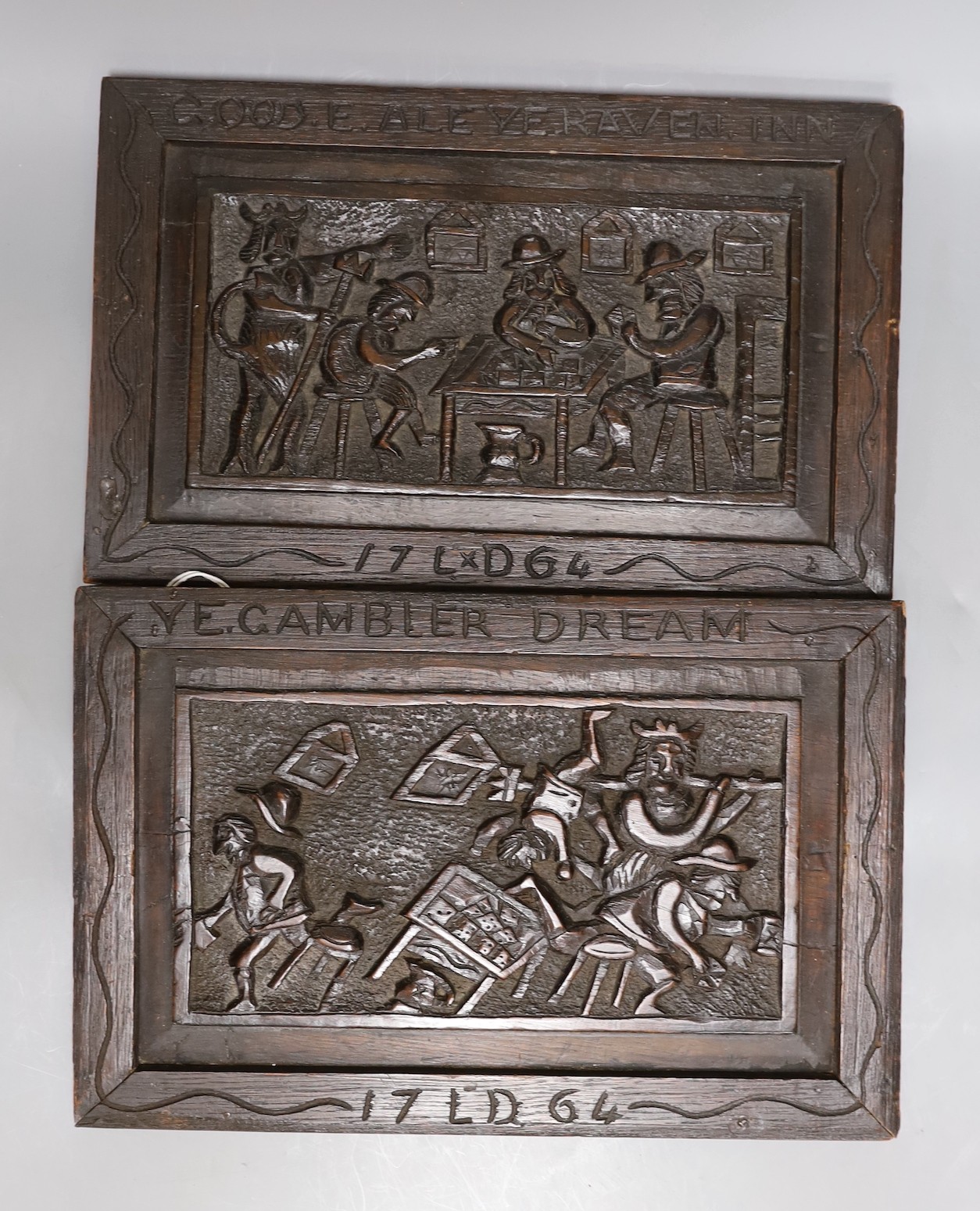 A pair of folk art oak panels, later frames:, “Good ale ye raven inn” and “Ye gambler dream”, 35.5 cms wide x 23 cms